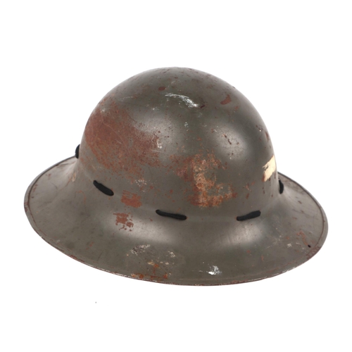 140 - A WWI Civil Defence Zuckerman helmet, the rim impressed 'M'.