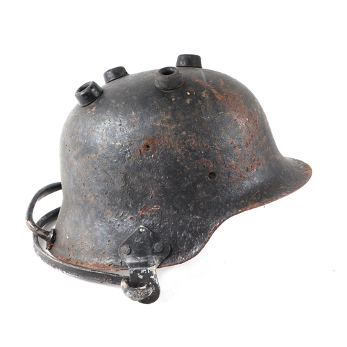 144 - A WWII German helmet converted to a cooking pot with swing handle.