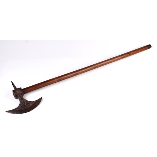 145 - A 19th century Indo Persian Tabar battle axe with peacock engraved to the blade, 81cm long