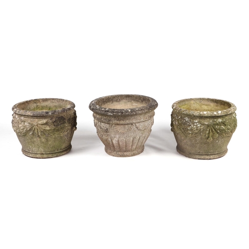 17 - A pair of well weathered reconstituted stone circular planters, 39cms diameter; together with anothe... 