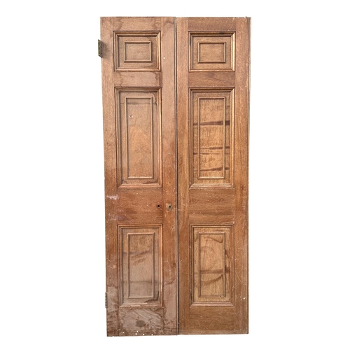 3 - A pair of large oak doors, each with three panels, both 208cms high and 48cms wide (2).