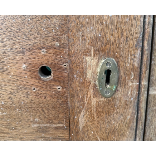 3 - A pair of large oak doors, each with three panels, both 208cms high and 48cms wide (2).