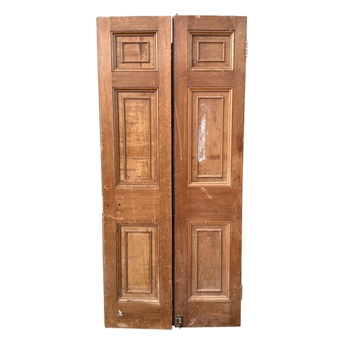 3 - A pair of large oak doors, each with three panels, both 208cms high and 48cms wide (2).