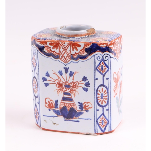 439 - A Delft three-colour octagonal tea caddy decorated with flowers, 10cms high.