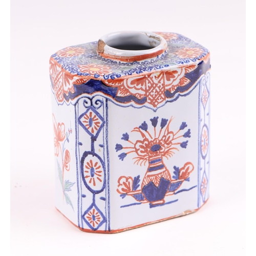 439 - A Delft three-colour octagonal tea caddy decorated with flowers, 10cms high.