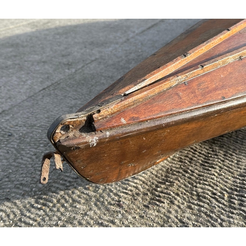 460 - A 1930's wooden single scull rowing boat, probably a Percy Blandford PBK14 kayak, 448cms (14ft 10ins... 