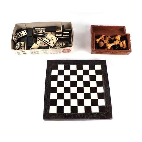 470 - A boxwood chess set; together with an ebony and bone chess board and draughts pieces.