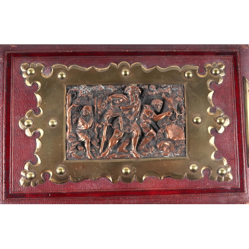 49 - A Victorian leather carte de visite album with copper panel decorated with figures in relief within ... 