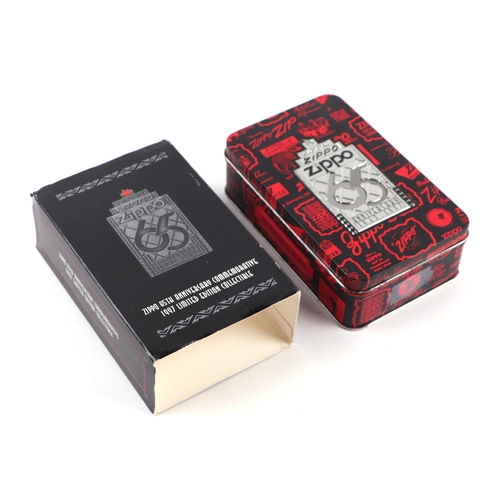 571 - A Zippo 1997 65th anniversary Commemorative Limited Edition boxed set, cased and unused.