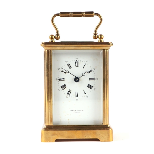 600 - A carriage clock, the white enamel dial with Roman and Arabic numerals, signed 'Taylor & Bligh, Engl... 