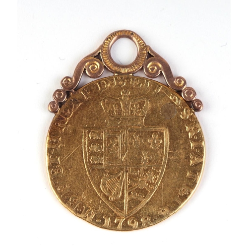 635 - A George III 1798 Spade Guinea on a yellow metal pendant mount, total weight 9g.