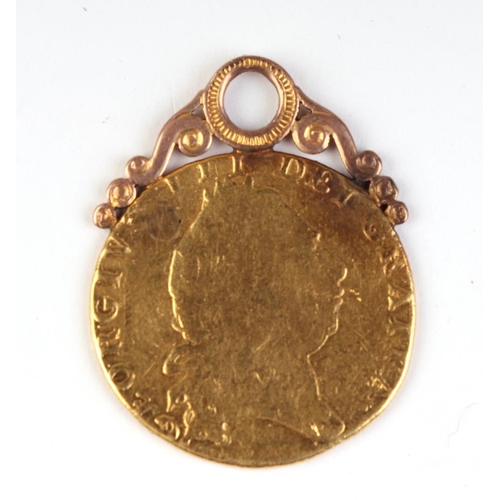 635 - A George III 1798 Spade Guinea on a yellow metal pendant mount, total weight 9g.