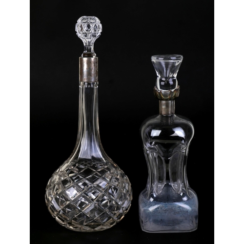 641 - A late Victorian cut glass decanter with silver collar, Sheffield 1899, 29cms high; together with an... 