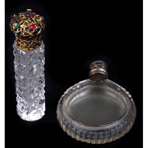 642 - A Victorian glass scent bottle with silver collar and cap, 6cms high and another similar, 4cms diame... 