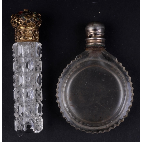 642 - A Victorian glass scent bottle with silver collar and cap, 6cms high and another similar, 4cms diame... 