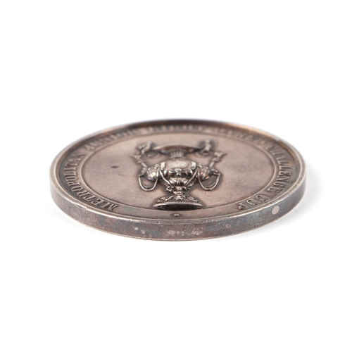 648 - An 1866 Metropolitan Junior 8 board Challenge Cup silver medallion, 86g.