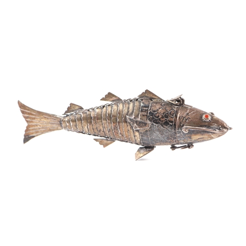 671 - A white metal (tests as silver) Jewish articulated fish Besamim spice box, 13cm long, 49g.