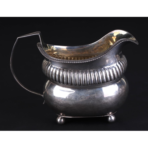 686 - A George III silver milk jug, London 1812 and maker's mark for Thomas Daniell, 9.5cms high, 153g.