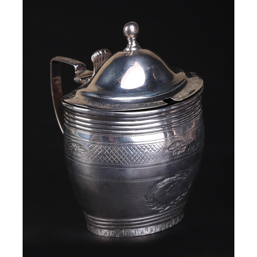 697 - A George III silver mustard pot with blue glass liner, London 1802 and maker's mark for Charles Fox,... 