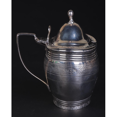 697 - A George III silver mustard pot with blue glass liner, London 1802 and maker's mark for Charles Fox,... 