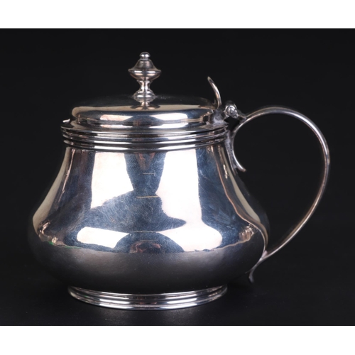 699 - A George III silver mustard pot, London 1817, 7.5cms high, 157g.