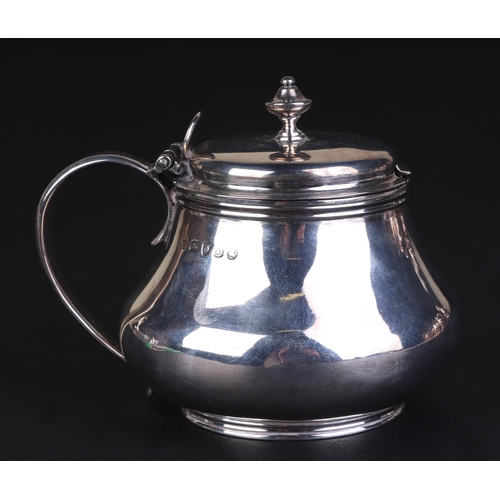 699 - A George III silver mustard pot, London 1817, 7.5cms high, 157g.