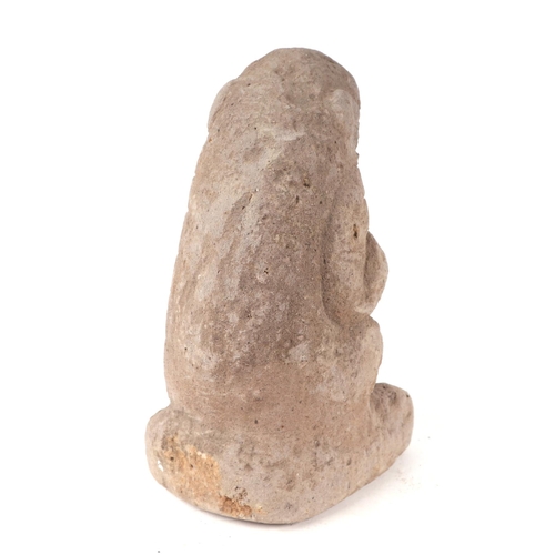 7 - A sandstone gargoyle type figure, 35cm high.