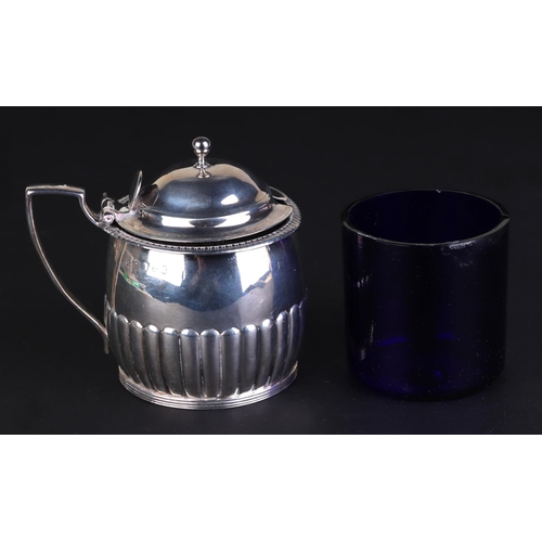 700 - A George III silver mustard pot with blue glass liner, London 1810 and maker's mark for Rebecca Emes... 