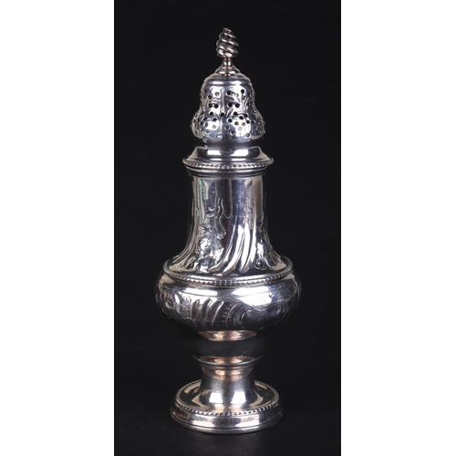 703 - A Georgian silver pepper with indistinct London hallmarks, 13.5cms high, 98g.