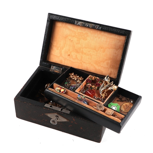 778 - A leather jewellery box containing vintage costume jewellery to include hat pins, brooches cufflinks... 