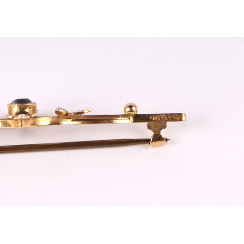 782 - A late Victorian / Edwardian 9ct gold seed pearl and blue stone bar brooch, 2.7g.