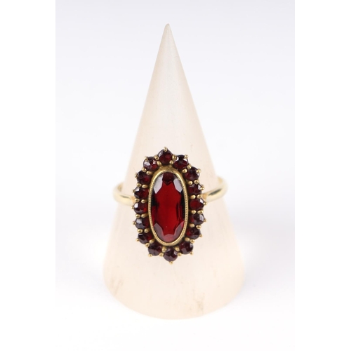 805 - A garnet cluster ring with 14ct gold shank, UK size O, 4g.