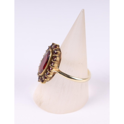 805 - A garnet cluster ring with 14ct gold shank, UK size O, 4g.