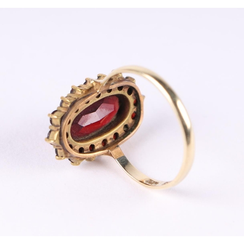 805 - A garnet cluster ring with 14ct gold shank, UK size O, 4g.