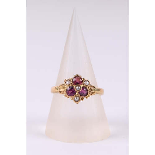 808 - An 18ct gold dress ring set with three pale pink stones and seed pearls, approx UK size N, 2.9g.