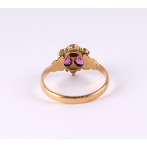 808 - An 18ct gold dress ring set with three pale pink stones and seed pearls, approx UK size N, 2.9g.