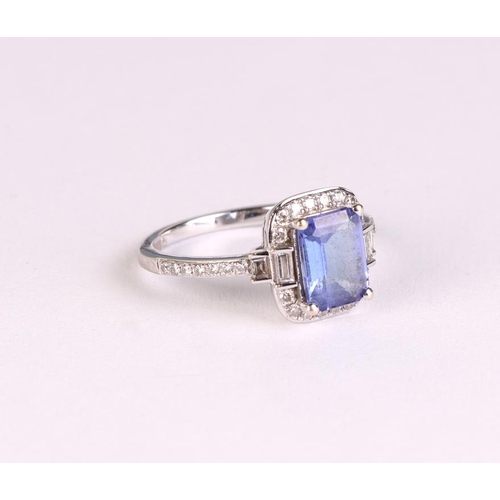 816 - An 18ct white gold tanzanite and diamond ring, approx UK size L, 3.4g.