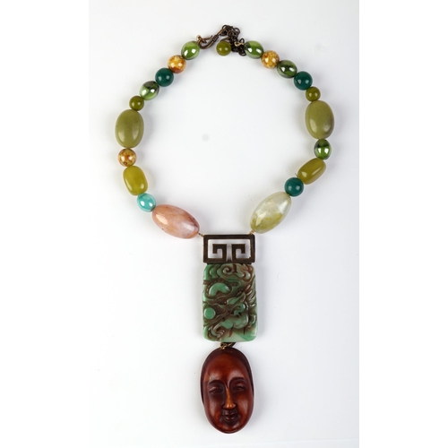 818 - Philippe Ferrandis, Paris, a contemporary bead necklace with jade and boxwood pendants.