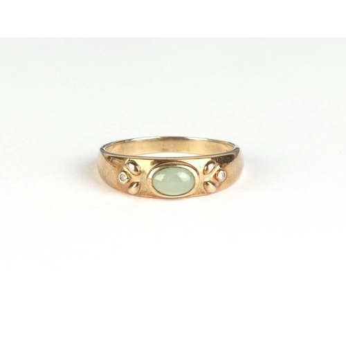 826 - A 9ct gold ring set with an oval jade cabochon, approx UK size Q, 2.7g.