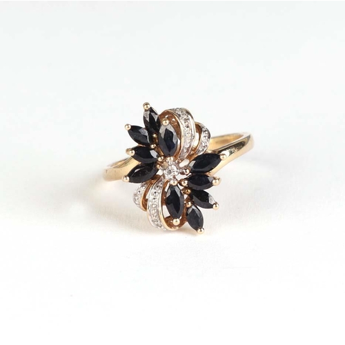 833 - A 9ct gold diamond and sapphire dress ring, approx UK size P, 3.1g.