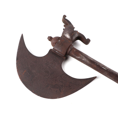 91 - An Indian axe with engraved crescent form axe head, 76cms long.