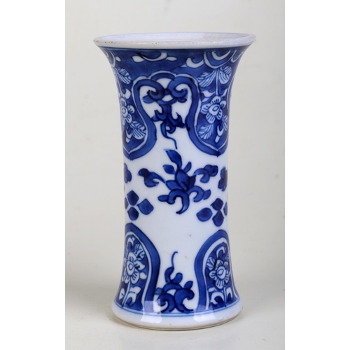 917 - A small Chinese blue and white vase of waisted form. 13cm high