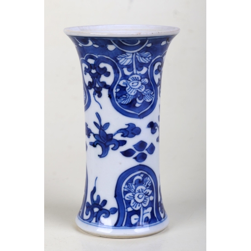 917 - A small Chinese blue and white vase of waisted form. 13cm high