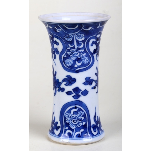 917 - A small Chinese blue and white vase of waisted form. 13cm high