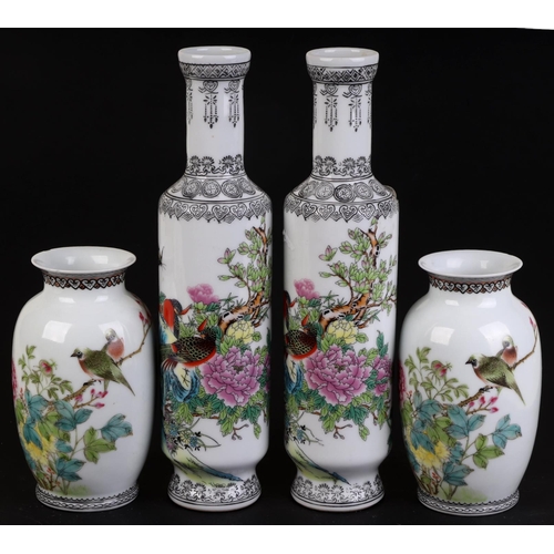 927 - A pair of Chinese Republic style vases of cylindrical form decorated with pheasants, butterflies and... 