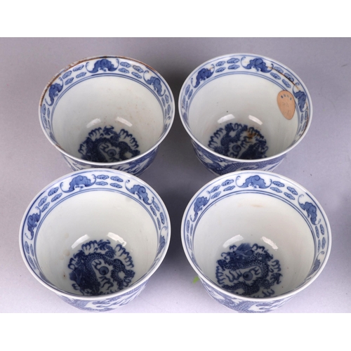 931 - Four Chinese blue & white tea bowls decorated with dragons amongst clouds chasing flaming pearls, si... 