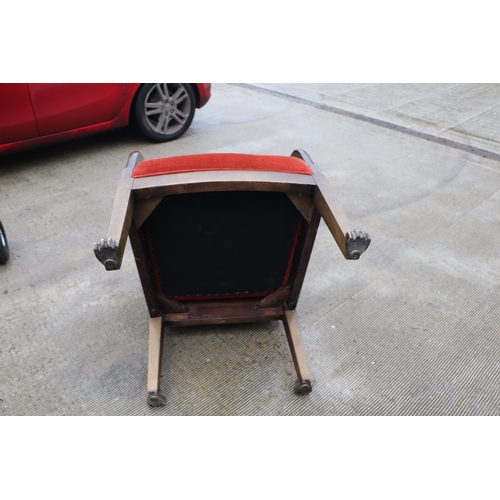 1025 - A pair of walnut high back throne type chairs with lion paw front feet (2).