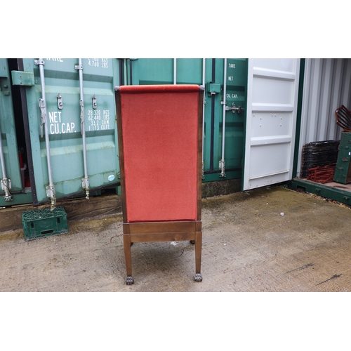 1025 - A pair of walnut high back throne type chairs with lion paw front feet (2).