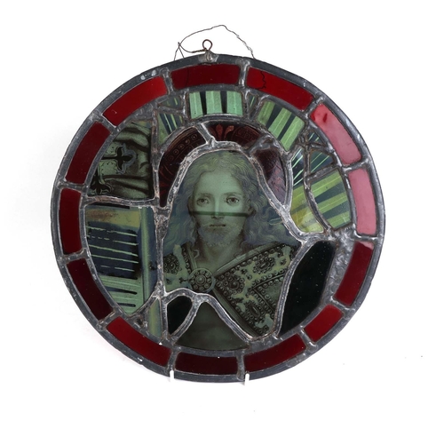 243 - A 19th century stained glass roundel panel depicting a saint, 35cms diameter.