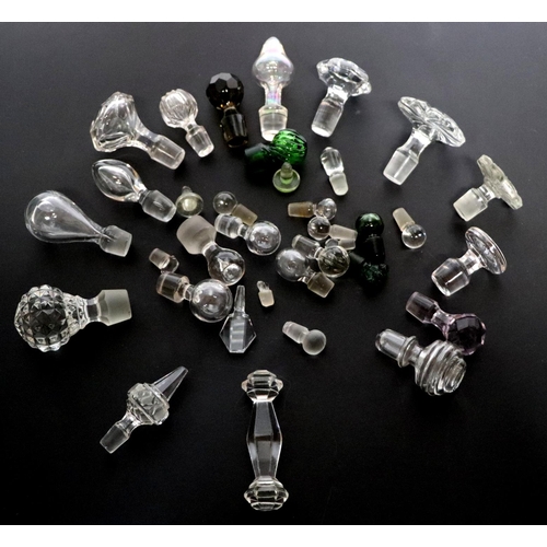 244 - A good selection of glass decanter stoppers to include faceted examples.